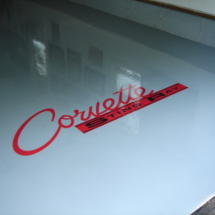 A close up of the corvette logo on a car.
