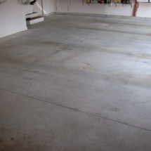 A garage floor that has been cleaned and is ready for painting.