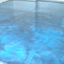 A blue floor with some water on it
