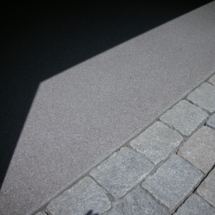 A close up of the corner of a sidewalk