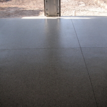 A concrete floor with some shadows on it