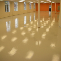 A large room with white floors and walls.
