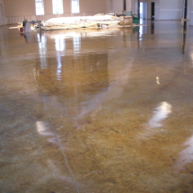 A large room with a floor that has been polished.