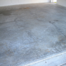 A concrete slab that has been cleaned and is ready for painting.