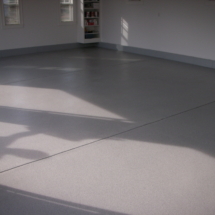 A room with a floor that has been painted white.