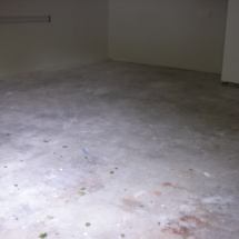 A room with white floors and a floor that has been cleaned.