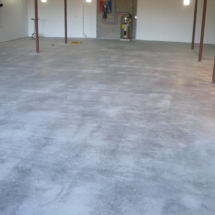 A room with concrete floors and walls.