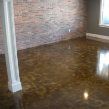 A room with a floor that has been polished.