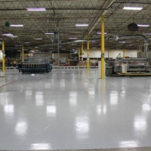 large warehouse with light grey epoxy flooring